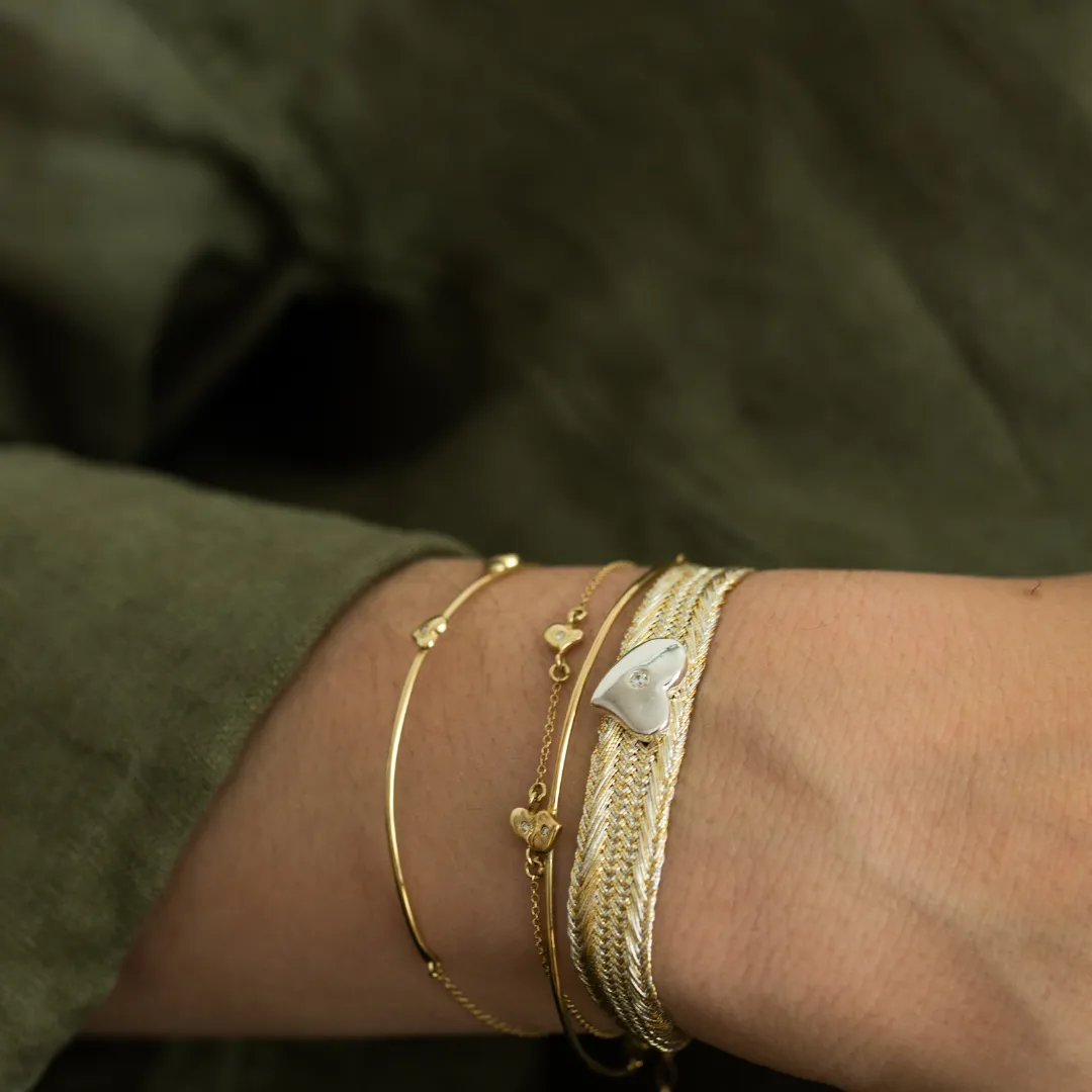 LES AMOURS Sfifa bracelet: Gold thread with sterling silver hearts.