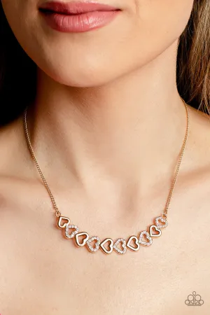 Sparkly Suitor - Gold - White Rhinestone Heart Paparazzi Short Necklace